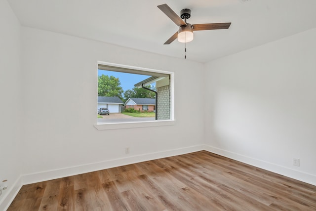 436 Crestwood Ter, Hurst, TX 76053 - empty room featuring wood finished floors, baseboards, and ceiling fan