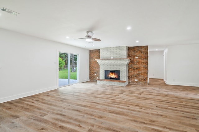 436 Crestwood Ter, Hurst, TX 76053 - unfurnished living room featuring light wood-style flooring, a ceiling fan, a brick fireplace, recessed lighting, and baseboards