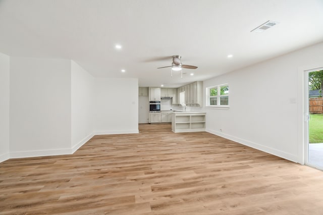 436 Crestwood Ter, Hurst, TX 76053 - unfurnished living room with a ceiling fan, baseboards, light wood-style flooring, and recessed lighting