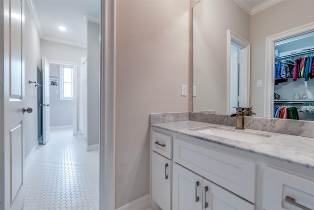6242 Vickery Blvd, Dallas, TX 75214 - bathroom with crown molding, vanity, a spacious closet, and baseboards