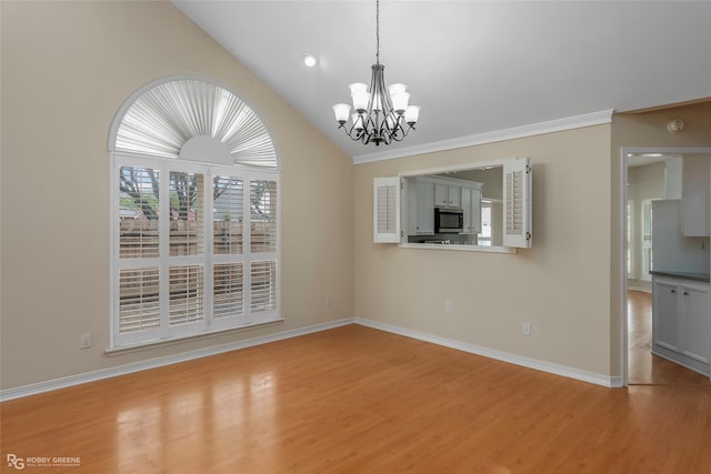 10085 Baldwin Ct, Shreveport, LA 71115 - unfurnished dining area featuring light wood-type flooring, lofted ceiling, a chandelier, baseboards, and crown molding