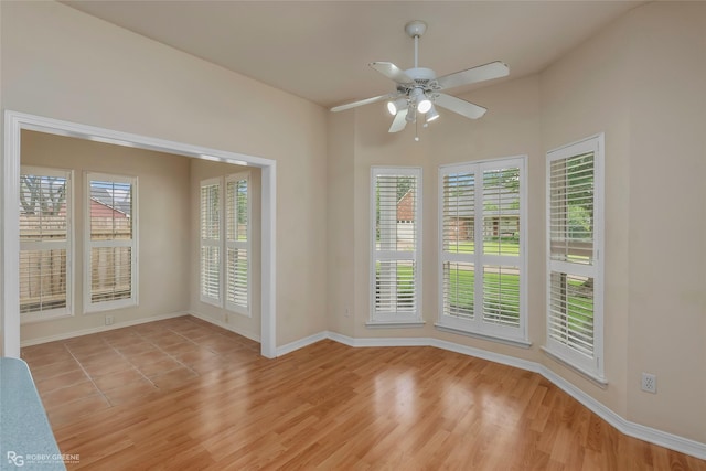 10085 Baldwin Ct, Shreveport, LA 71115 - spare room featuring plenty of natural light, ceiling fan, light wood-style flooring, and baseboards