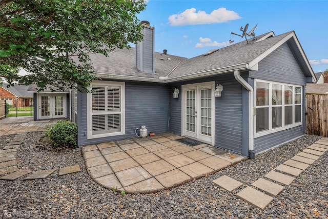 10085 Baldwin Ct, Shreveport, LA 71115 - rear view of house featuring french doors, a patio area, a chimney, and roof with shingles