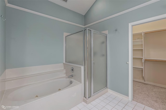 10085 Baldwin Ct, Shreveport, LA 71115 - bathroom with a stall shower, a jetted tub, a spacious closet, tile patterned flooring, and baseboards