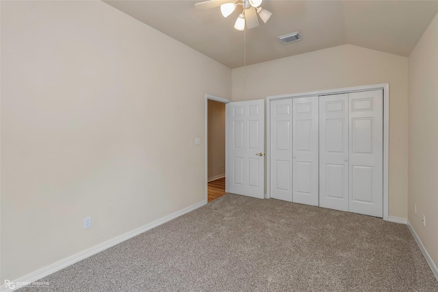 10085 Baldwin Ct, Shreveport, LA 71115 - unfurnished bedroom featuring carpet flooring, vaulted ceiling, baseboards, ceiling fan, and a closet