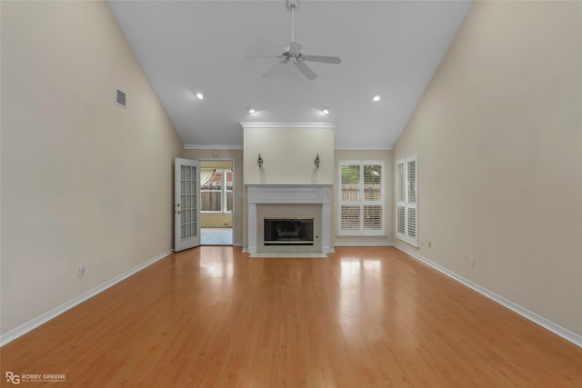 10085 Baldwin Ct, Shreveport, LA 71115 - unfurnished living room featuring a ceiling fan, a fireplace with flush hearth, light wood-style floors, baseboards, and ornamental molding
