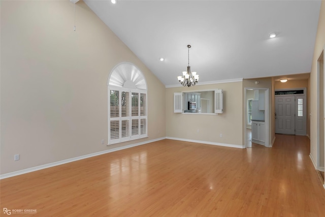10085 Baldwin Ct, Shreveport, LA 71115 - unfurnished living room with a chandelier, baseboards, light wood-style flooring, recessed lighting, and high vaulted ceiling