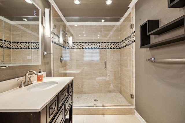 9834 Carnegie Dr, Dallas, TX 75228 - full bathroom with vanity, a stall shower, recessed lighting, and baseboards