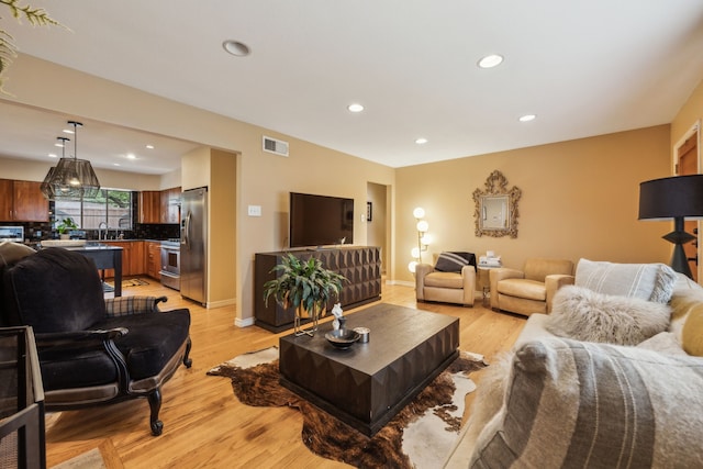 9834 Carnegie Dr, Dallas, TX 75228 - living room with recessed lighting, light wood-style flooring, and baseboards