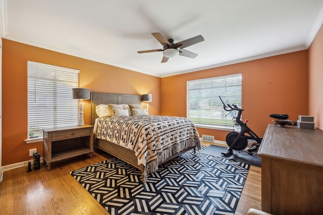 9834 Carnegie Dr, Dallas, TX 75228 - bedroom featuring wood finished floors, baseboards, crown molding, and a ceiling fan