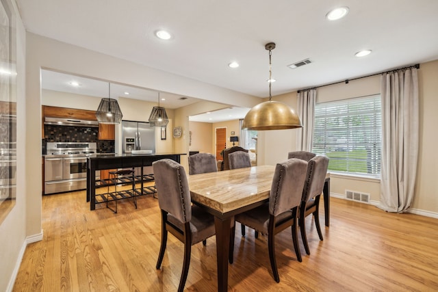 9834 Carnegie Dr, Dallas, TX 75228 - dining space with light wood-style floors, baseboards, and recessed lighting