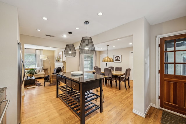 9834 Carnegie Dr, Dallas, TX 75228 - dining room featuring light wood-style floors, healthy amount of natural light, recessed lighting, and baseboards