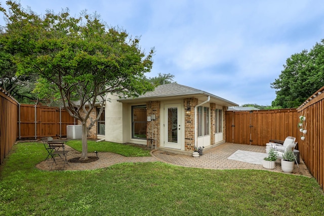 4040 Morman Ln, Addison, TX 75001 - back of house featuring a patio, a shingled roof, cooling unit, and brick siding