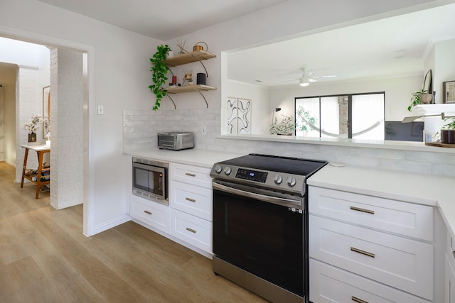 4040 Morman Ln, Addison, TX 75001 - kitchen with appliances with stainless steel finishes, open shelves, light wood-type flooring, and light countertops