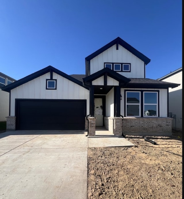1204 Toro Trl, Fort Worth, TX 76052 - modern farmhouse featuring a garage, driveway, brick siding, board and batten siding, and a shingled roof