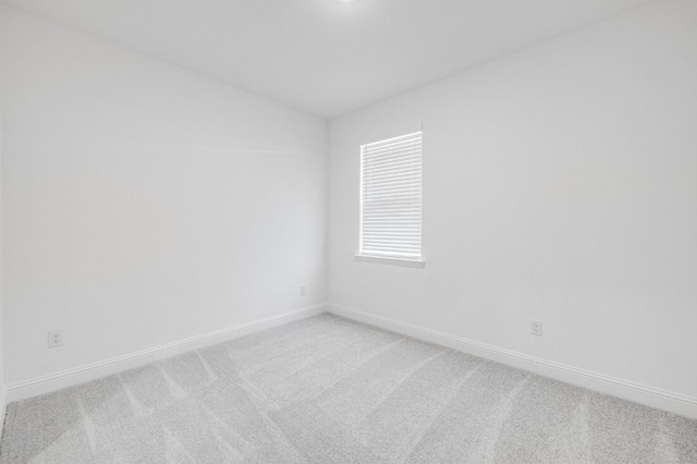 1204 Toro Trl, Fort Worth, TX 76052 - empty room with lofted ceiling, light carpet, and baseboards