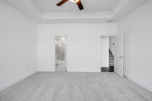 1204 Toro Trl, Fort Worth, TX 76052 - spare room featuring a ceiling fan, stairs, carpet, and a raised ceiling