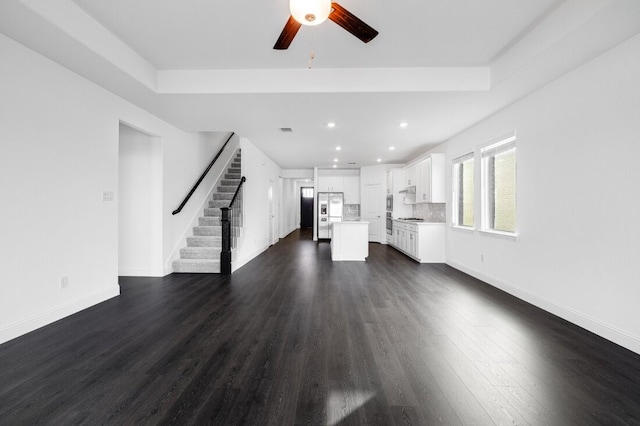 1204 Toro Trl, Fort Worth, TX 76052 - unfurnished living room with a ceiling fan, recessed lighting, dark wood-type flooring, stairs, and baseboards