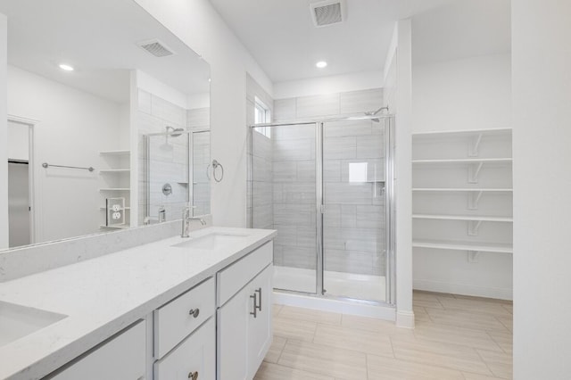 1204 Toro Trl, Fort Worth, TX 76052 - full bathroom featuring a shower stall, double vanity, recessed lighting, and a walk in closet