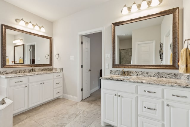 8900 Hidden Pond St, Justin, TX 76247 - bathroom featuring vanity, baseboards, and marble look tiles
