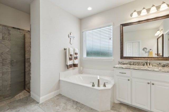 8900 Hidden Pond St, Justin, TX 76247 - full bath featuring marble look tile flooring, a garden tub, vanity, a stall shower, and baseboards