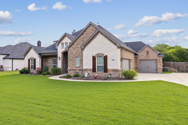 8900 Hidden Pond St, Justin, TX 76247 - french provincial home with driveway, an attached garage, brick siding, and a chimney
