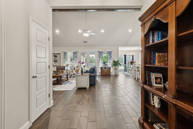 8900 Hidden Pond St, Justin, TX 76247 - corridor with a chandelier, high vaulted ceiling, and dark wood-type flooring