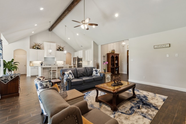8900 Hidden Pond St, Justin, TX 76247 - living room featuring a ceiling fan, beamed ceiling, dark wood-type flooring, baseboards, and high vaulted ceiling