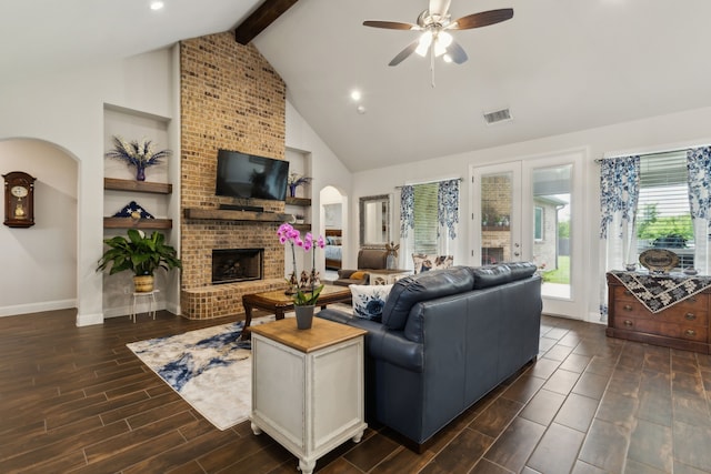 8900 Hidden Pond St, Justin, TX 76247 - living area featuring high vaulted ceiling, a brick fireplace, beamed ceiling, a ceiling fan, and baseboards