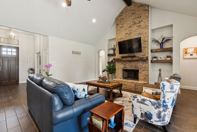 8900 Hidden Pond St, Justin, TX 76247 - living room featuring dark wood finished floors, arched walkways, high vaulted ceiling, baseboards, and a ceiling fan