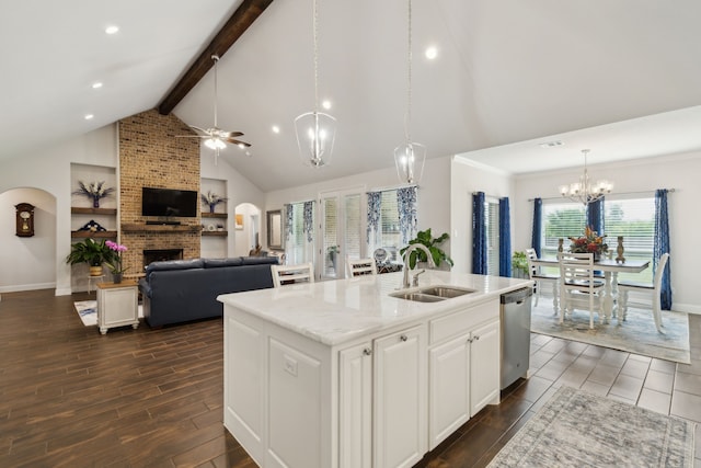 8900 Hidden Pond St, Justin, TX 76247 - kitchen with a sink, a chandelier, beamed ceiling, a brick fireplace, and stainless steel dishwasher