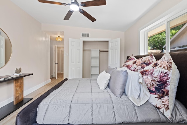 10528 Swallow Ln, Dallas, TX 75218 - bedroom with a closet, wood finished floors, baseboards, and a ceiling fan