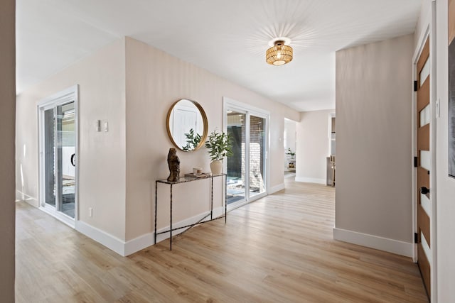 10528 Swallow Ln, Dallas, TX 75218 - entryway featuring light wood-style floors and baseboards
