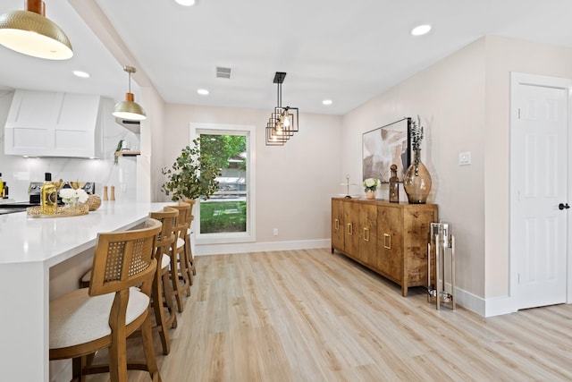 10528 Swallow Ln, Dallas, TX 75218 - dining space with light wood-style floors, baseboards, and recessed lighting