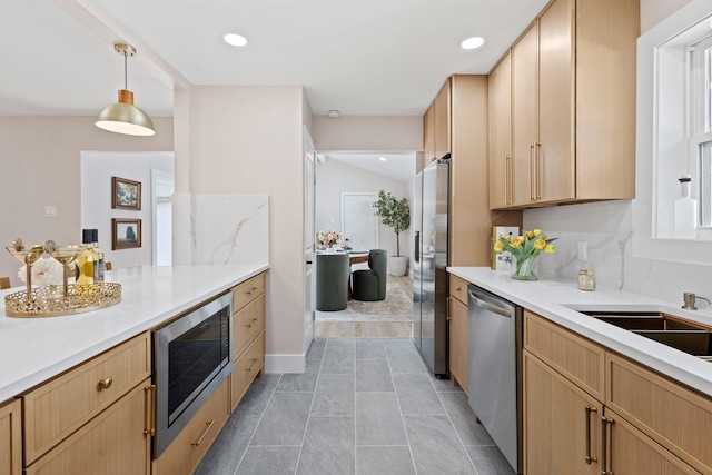 10528 Swallow Ln, Dallas, TX 75218 - kitchen with appliances with stainless steel finishes, light brown cabinetry, light countertops, and recessed lighting