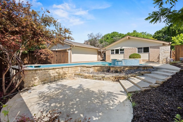 10528 Swallow Ln, Dallas, TX 75218 - view of front of home with brick siding and a patio