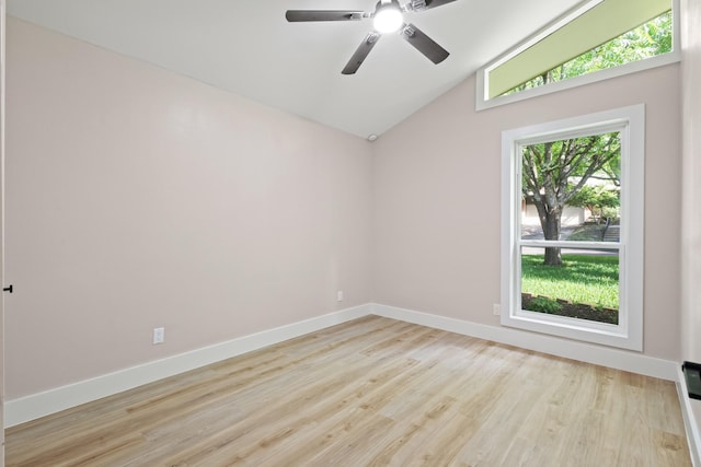 10528 Swallow Ln, Dallas, TX 75218 - spare room featuring wood finished floors, vaulted ceiling, baseboards, and a ceiling fan