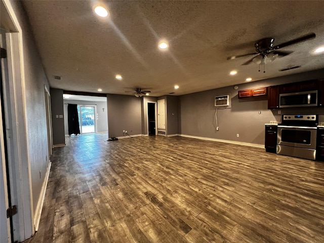 106 Lane St, Comanche, TX 76442 - unfurnished living room featuring a ceiling fan, recessed lighting, dark wood-style flooring, baseboards, and a textured ceiling
