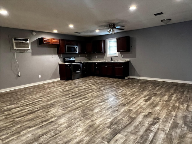 106 Lane St, Comanche, TX 76442 - kitchen featuring stainless steel appliances, baseboards, dark wood-style flooring, light countertops, and recessed lighting