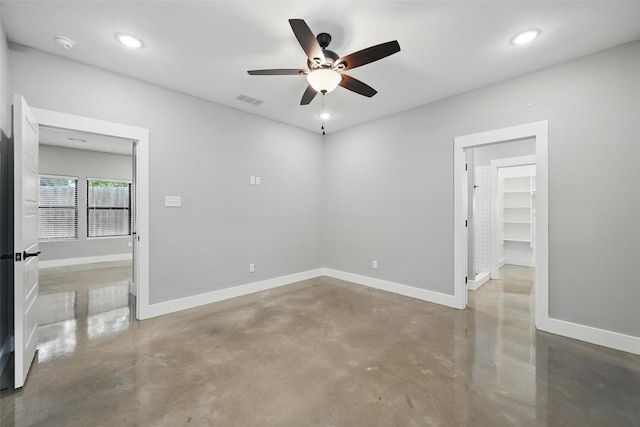 713 E Texas St, Denison, TX 75021 - empty room with finished concrete floors, ceiling fan, baseboards, recessed lighting, and a smoke detector