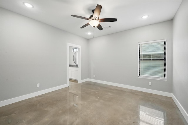 713 E Texas St, Denison, TX 75021 - empty room with concrete flooring, ceiling fan, recessed lighting, and baseboards