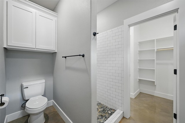 713 E Texas St, Denison, TX 75021 - full bath with a shower stall, toilet, baseboards, and concrete floors
