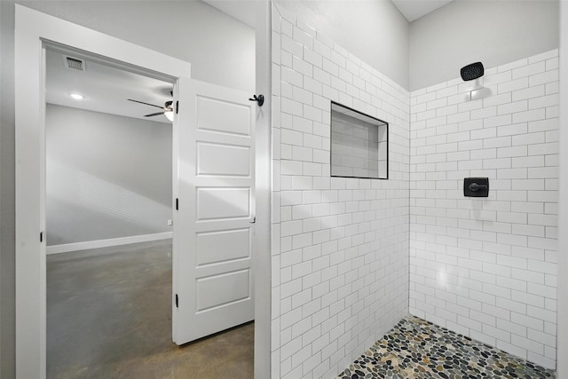 713 E Texas St, Denison, TX 75021 - full bath with tiled shower, ceiling fan, and concrete flooring