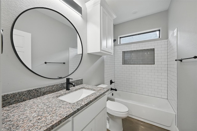 713 E Texas St, Denison, TX 75021 - bathroom with vanity, tub / shower combination, and toilet