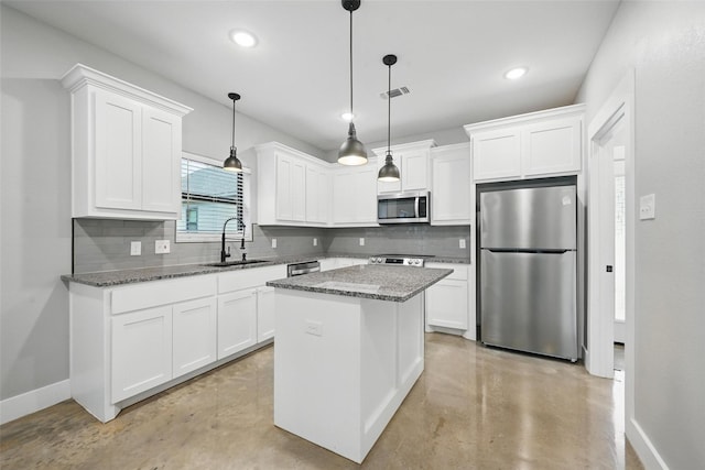 713 E Texas St, Denison, TX 75021 - kitchen featuring appliances with stainless steel finishes, a sink, concrete flooring, backsplash, and baseboards