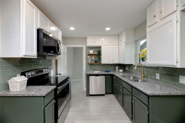 7333 Pensacola Ave, Fort Worth, TX 76116 - kitchen featuring stainless steel appliances, a sink, white cabinets, and recessed lighting