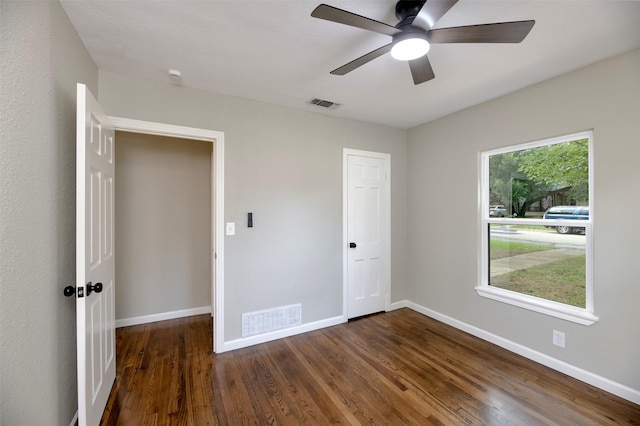 7333 Pensacola Ave, Fort Worth, TX 76116 - unfurnished bedroom featuring dark wood-style flooring, baseboards, ceiling fan, and a closet