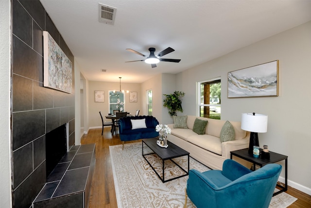 7333 Pensacola Ave, Fort Worth, TX 76116 - living room with plenty of natural light, wood finished floors, ceiling fan, and a tiled fireplace