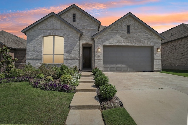 2208 13th St, Argyle, TX 76226 - french provincial home with a garage, concrete driveway, a lawn, and brick siding