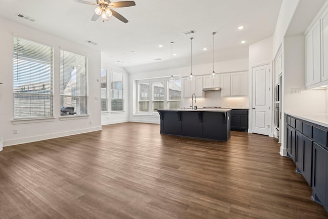 2208 13th St, Argyle, TX 76226 - kitchen with a sink, a ceiling fan, open floor plan, recessed lighting, and a breakfast bar area